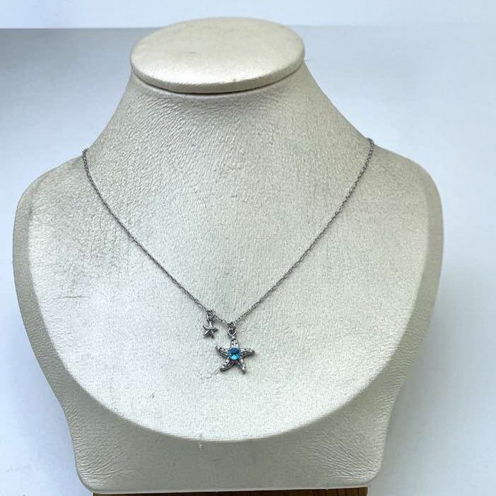 Minimal κολιέ από ανοξείδωτο ατσάλι με charm αστερία και γαλάζια πέτρα, ιδανικό για elegant summer looks