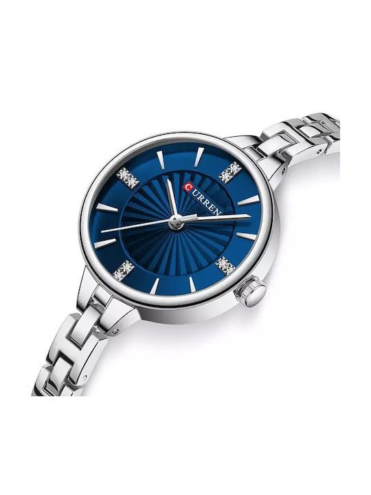 Ανακαλύψτε το Curren 9097 Silver, ένα κομψό γυναικείο ρολόι με ασημί, ατσάλινο μπρασελέ και στρογγυλό καντράν με διακοσμητικά στρας